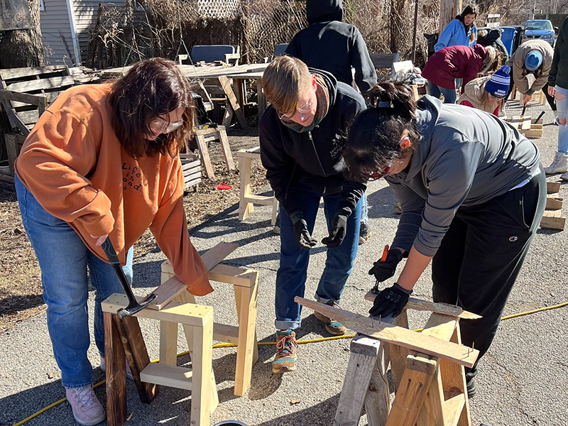 Volunteers building wooden structures in Chicago