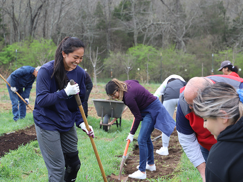 Students volunteering outdoors in Tennessee