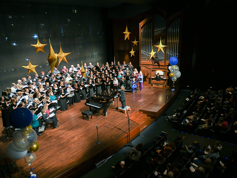 Chorale performing with alumni.