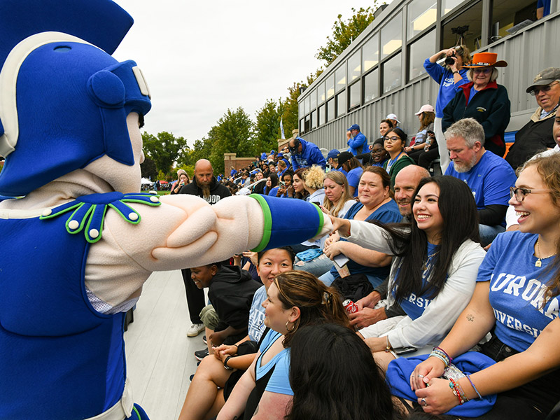 Sammy Spartan with football fans.