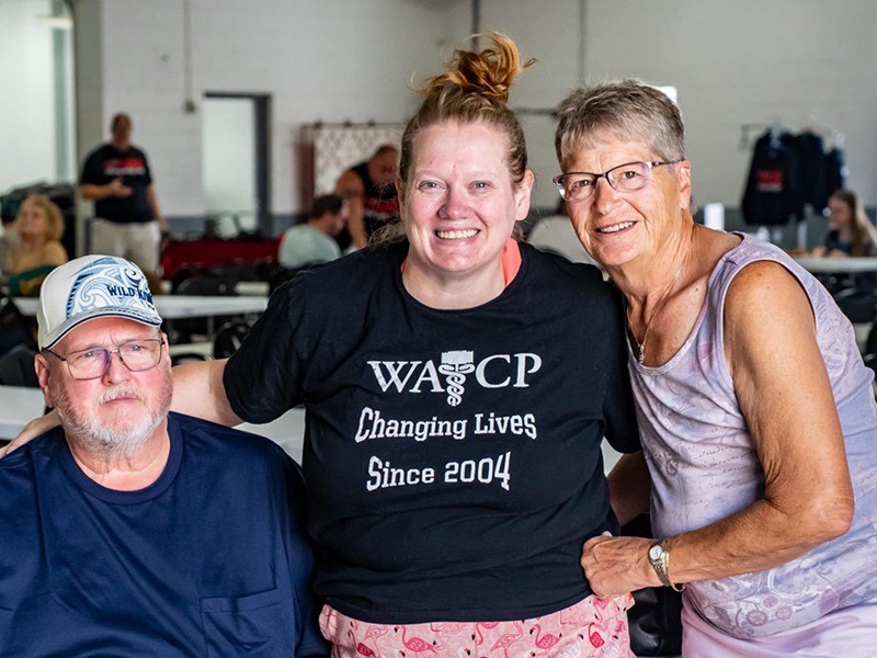 Amanda Parlow with her parents at a community event