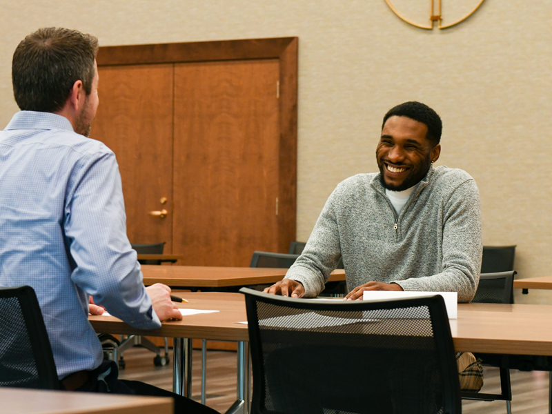 Student working with an interviewer.