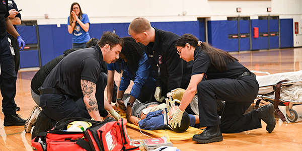 students working collaboratively on emergency simulation