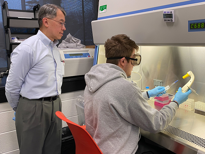 Student and professor in a lab