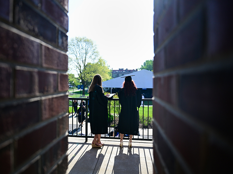 graduates overlooking the quad