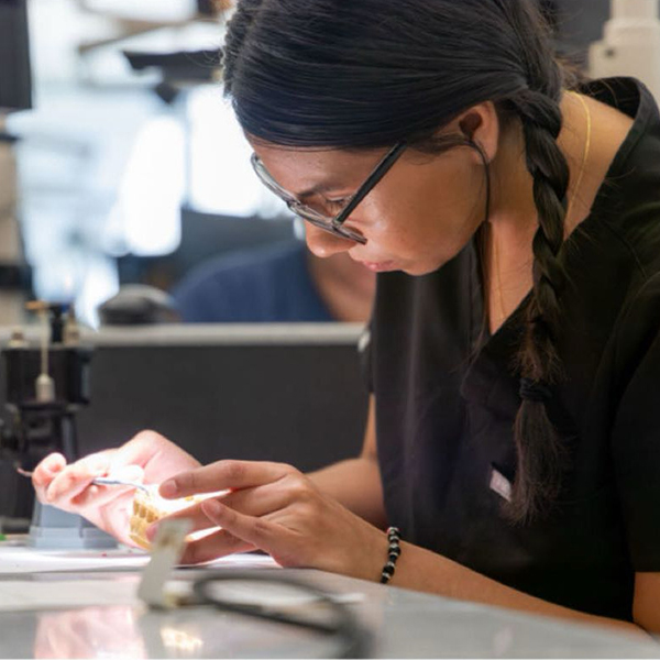 Andrea Garcia works on dental model