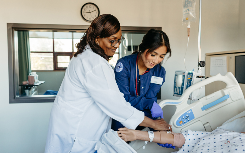 Nursing professor with a student.