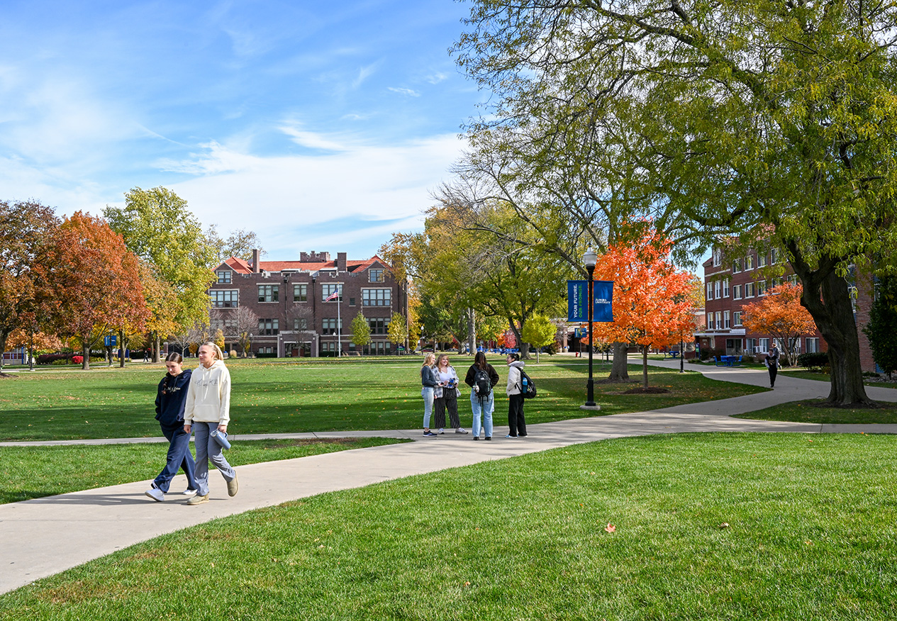 AU students walking and talking near the Quad.
