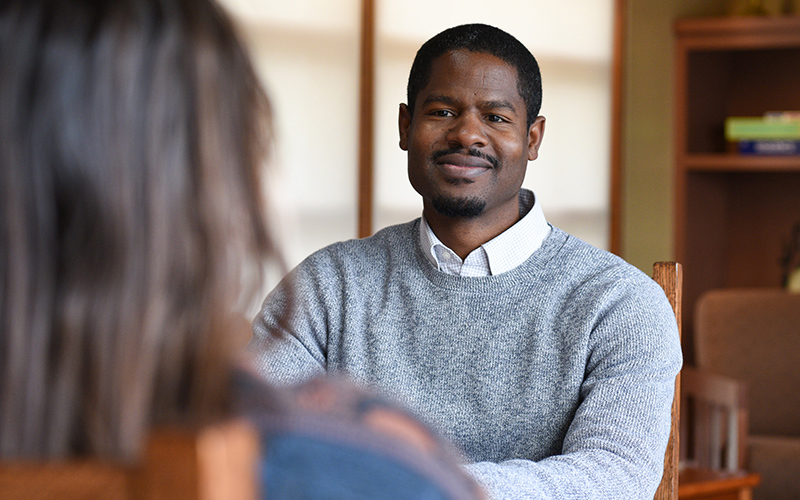 staff member talking to student