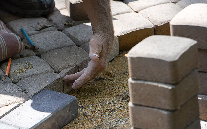Pavers being laid during the labyrinth construction.