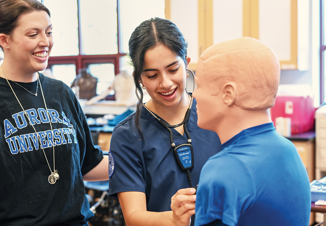 A student and an instructor in a nursing lab