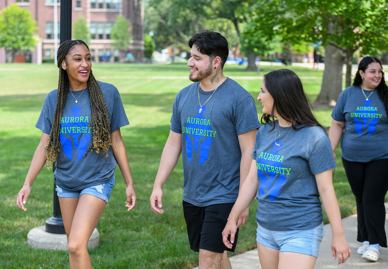 students walking on campus in the late spring